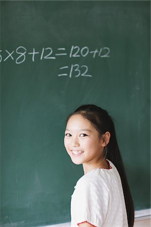 preteen asia - Schoolgirl Solving Math Problem Stock Photo - Rights-Managed, Code: 859-03860823