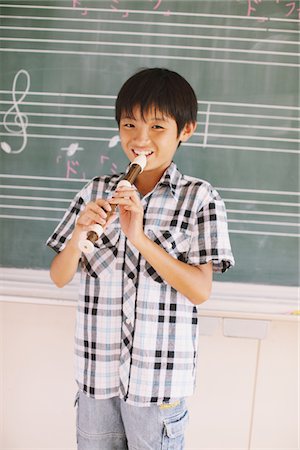 Japanese Schoolboy Playing Flute Foto de stock - Con derechos protegidos, Código: 859-03860844