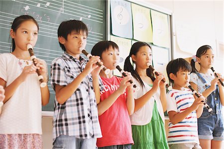 people holding chalkboards in pictures - Children In Music Class Playing Flute Stock Photo - Rights-Managed, Code: 859-03860845