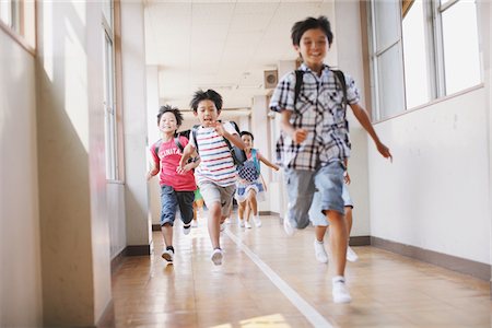 Children Running In School Corridor Foto de stock - Con derechos protegidos, Código: 859-03860856