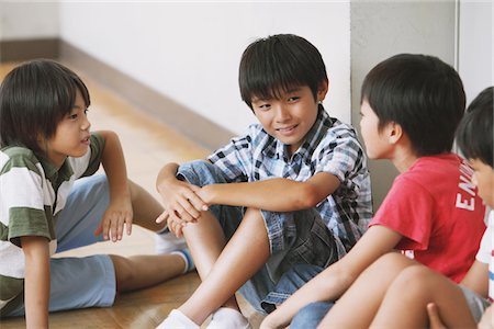 studying young asian boy - Boys Sitting On Floor In Classroom Stock Photo - Rights-Managed, Code: 859-03860852