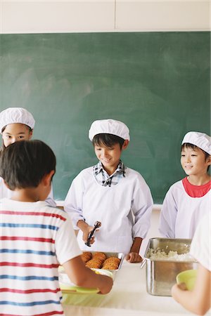 distribution - Student Serving Food In Classroom Stock Photo - Rights-Managed, Code: 859-03860894