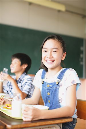 Girl Having Meal And Smiling Stock Photo - Rights-Managed, Code: 859-03860915