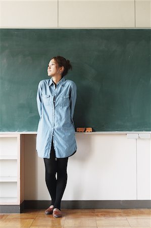 Female Standing In Front Of Blackboard Stock Photo - Rights-Managed, Code: 859-03860991