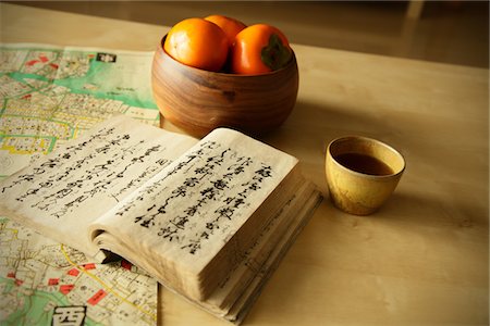 still life with tea - Book and Japanese persimmon Stock Photo - Rights-Managed, Code: 859-03884673