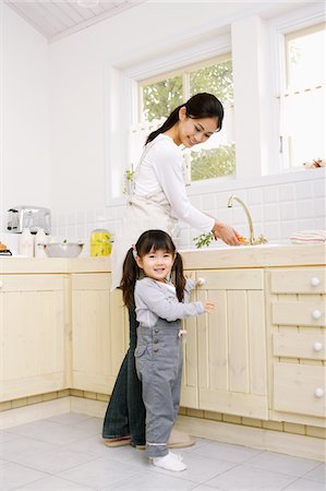 Mother And Daughter In Kitchen Stock Photo - Rights-Managed, Code: 859-03884840