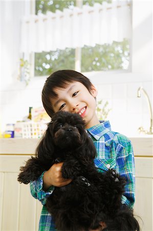 simsearch:859-03884830,k - Boy Holding Pet Foto de stock - Con derechos protegidos, Código: 859-03884885
