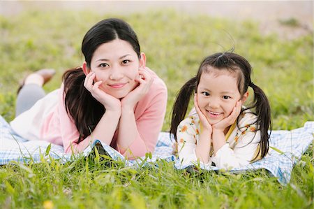 simsearch:859-03840315,k - Mother And Daughter Lying In Meadow Stock Photo - Rights-Managed, Code: 859-03885006