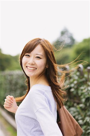 Japanese Women Looking Back While Walking Stock Photo - Rights-Managed, Code: 859-03885310