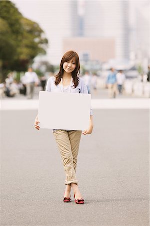 ethnic holding sign - Japanese Women Holding Whiteboard Stock Photo - Rights-Managed, Code: 859-03885363