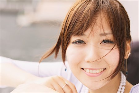 simsearch:622-06190754,k - Close-Up View Of Smiling Woman's Face Stock Photo - Rights-Managed, Code: 859-03885379