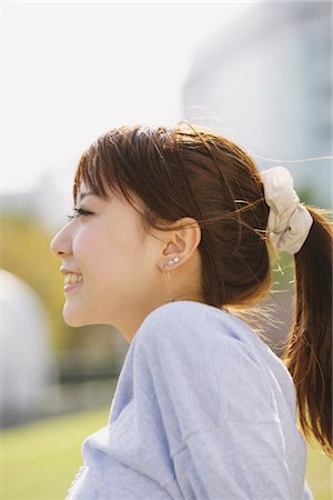 simsearch:859-03860564,k - Side View Of Smiling Young Woman Stock Photo - Rights-Managed, Code: 859-03885397