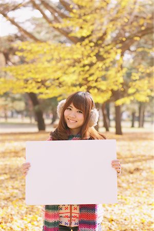 ethnic holding sign - Japanese Women Holding Whiteboard In Park Stock Photo - Rights-Managed, Code: 859-03885446