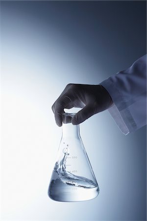 Scientist Holding Flask Stock Photo - Rights-Managed, Code: 859-03982254