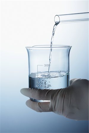 flask beaker - Dropping Liquid Into Beaker Stock Photo - Rights-Managed, Code: 859-03982272