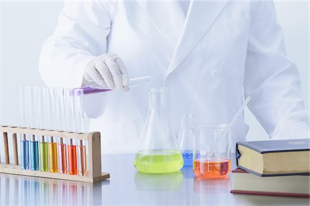 Scientist Dropping Liquid Into Flask Stock Photo - Rights-Managed, Code: 859-03982323