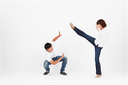 practicing (non sports) - Women Kicking While Man In Self Defense Stock Photo - Rights-Managed, Code: 859-03982456