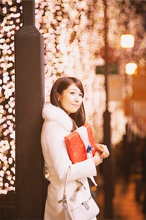 Pretty Young Women Leaning Against Pole Stock Photo - Rights-Managed, Code: 859-03982531