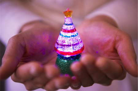 Small Colorful Christmas Tree On Human Hand Stock Photo - Rights-Managed, Code: 859-03982544