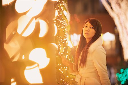 Japanese Women Walking Outdoor And Surrounded By Lightening Fotografie stock - Rights-Managed, Codice: 859-03982561