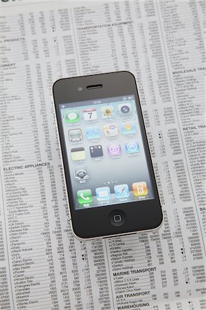 stock market - Apple iPhone  On Newspaper Stock Photo - Rights-Managed, Code: 859-03982596
