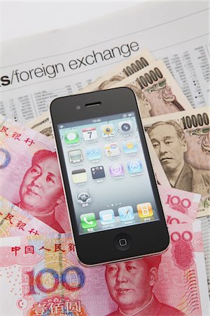 Apple iPhone  On Various Japanese And Chinese Notes Foto de stock - Con derechos protegidos, Código: 859-03982597