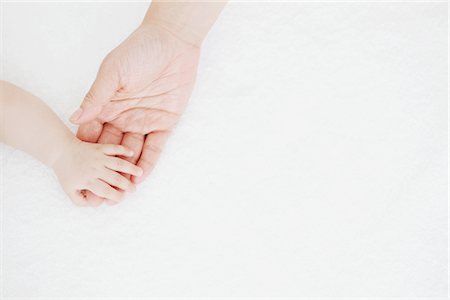 soft skin female - Hands Of Mother And Baby Stock Photo - Rights-Managed, Code: 859-03982704