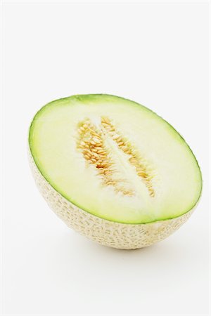 Melon de moitié en tranches Earl sur fond blanc Photographie de stock - Rights-Managed, Code: 859-03983006