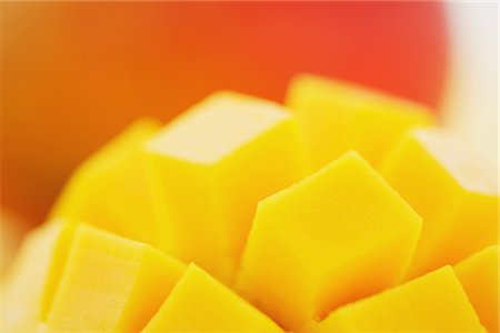 Close Up Of Sliced Apple Mango Foto de stock - Con derechos protegidos, Código: 859-03983017