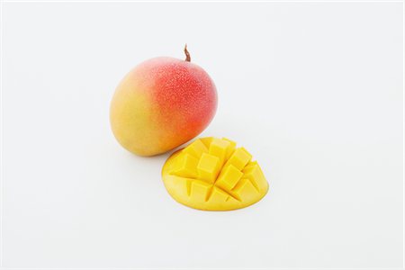 Sliced Apple Mango On White Background Stock Photo - Rights-Managed, Code: 859-03983010