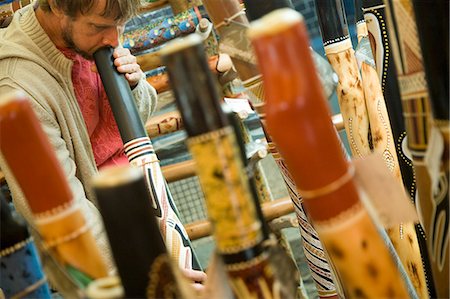 Man playing didgeridoo at stall in market,Sydney,New South Wales,Australia Stock Photo - Rights-Managed, Code: 851-02958751