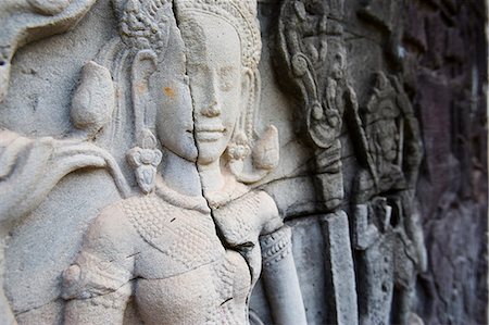 simsearch:851-02961313,k - La représentation des femmes sculptées sur le mur du temple du Bayon, Angkor, Siem Reap, Cambodge Photographie de stock - Rights-Managed, Code: 851-02959015