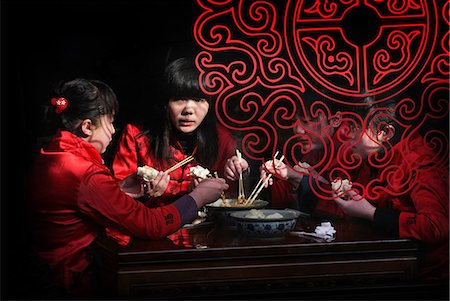 dumplings - Chinese girls eating with chopsticks in Pingyao,a UNESCO World Heritage Site,Shanxi,China Stock Photo - Rights-Managed, Code: 851-02959128