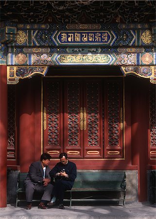 Two chinese men trying to use a camera,Chengdu,Sichuan,China. Stock Photo - Rights-Managed, Code: 851-02959164