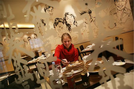 steamer - Woman eating dumplings with chopsticks at Din Tai Fung Dumpling House,Xintiandi (XinTianDi),Shanghai,China Stock Photo - Rights-Managed, Code: 851-02959192