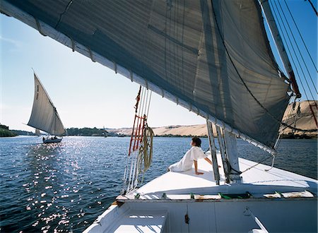 Woman on bow of felucca on River Nile,Aswan,Egypt Stock Photo - Rights-Managed, Code: 851-02959547