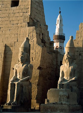 Colossi of Ramses 2nd with minaret,Luxor Temple,Luxor,Egypt Stock Photo - Rights-Managed, Code: 851-02959585