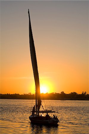sailboat silhouette - Felucca on River Nile at dusk,Luxor,Egypt Stock Photo - Rights-Managed, Code: 851-02959607