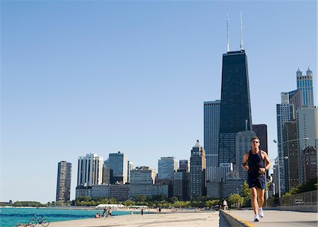 single caucasian male jogging - Man jogging on lakefront path along Oak Street Beach,Chicago,Illinois,USA Stock Photo - Rights-Managed, Code: 851-02964139