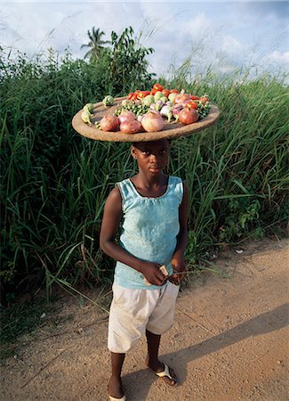 Boy carrying fruit on his head,Accra,Ghana Stock Photo - Rights-Managed, Code: 851-02960006