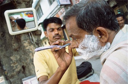 espuma de afeitar - Man being shaved by barber,India Foto de stock - Con derechos protegidos, Código: 851-02960286