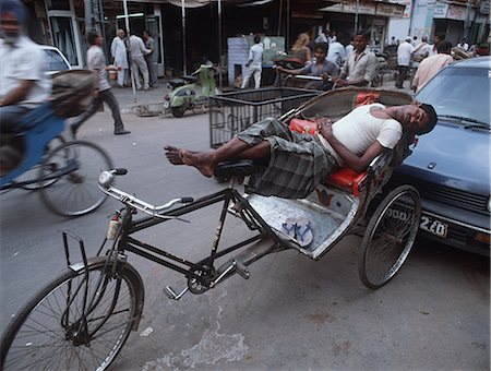 rickshaw - Rickshaw driver sleeping on vehicle,New Delhi,India Stock Photo - Rights-Managed, Code: 851-02960298