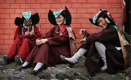 Women in traditional headwear sitting by brock wall,Diskyid,Nubra Valley,Leh Ladakh,India Stock Photo - Rights-Managed, Code: 851-02960408