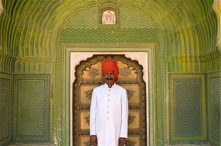 Palace guard in decorated entrance area of small door of the City Palace,Jaipur,Rajasthan,India Foto de stock - Con derechos protegidos, Código: 851-02960492