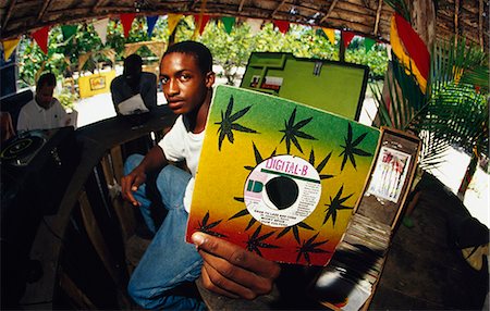 record shop - Young man holding record up,Ocho Rios,Jamaica Stock Photo - Rights-Managed, Code: 851-02960973