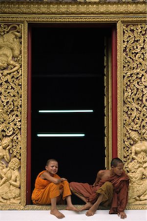 picture countryside of laos - Monks in the window,Luang Prabang,Laos. Stock Photo - Rights-Managed, Code: 851-02961364