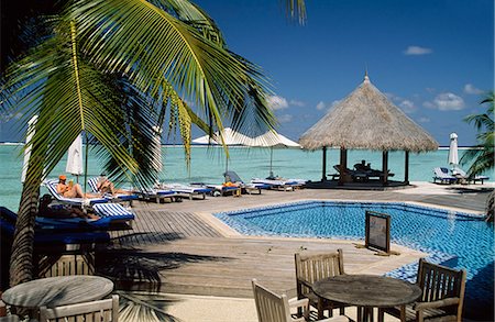 sun bather - Poolside,Four Seasons Resort,Kuda Huraa,Maldives Stock Photo - Rights-Managed, Code: 851-02961700