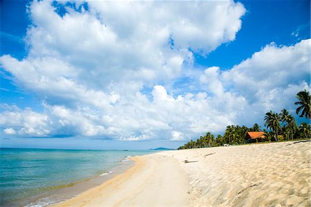 Surf lapping up on deserted beach,Penarek Inn beach huts,Penarek,Terengganu,Malaysia Stock Photo - Rights-Managed, Code: 851-02961779