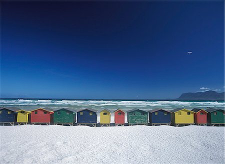Looking out to False Bay over beach huts on Muizenburg beach,Cape Town,South Africa. Stock Photo - Rights-Managed, Code: 851-02962541