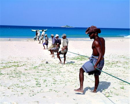 sri lanka fishermen - Fishermen draw in nets to the beach,Nilaveli Beach,Trincomalee District,Sri Lanka Stock Photo - Rights-Managed, Code: 851-02962726